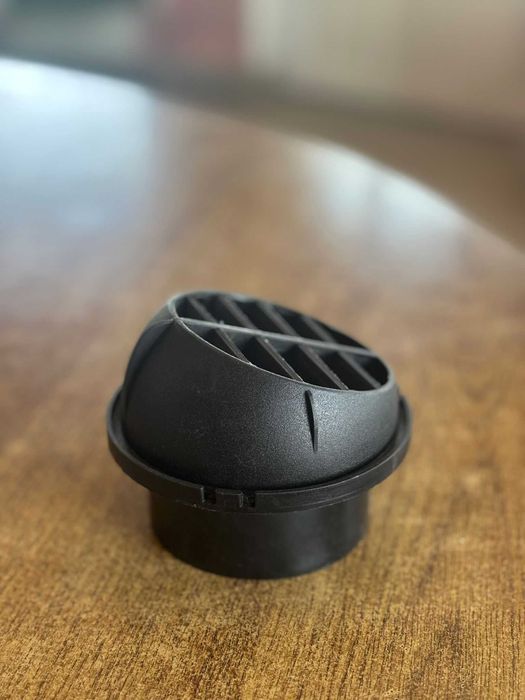 Grilă rotativă pentru evacuarea aerului