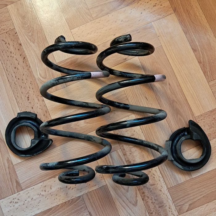 Пружины задние, нижние опоры пружин Nissan Note, Micra