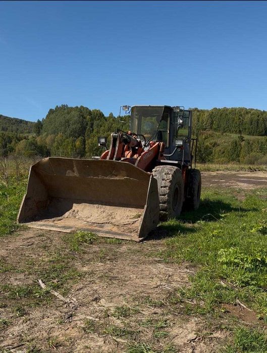 Продам погрузчик Hitachi LX 230