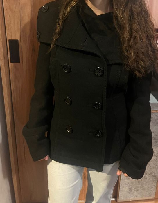 Palton în stare aproape nou