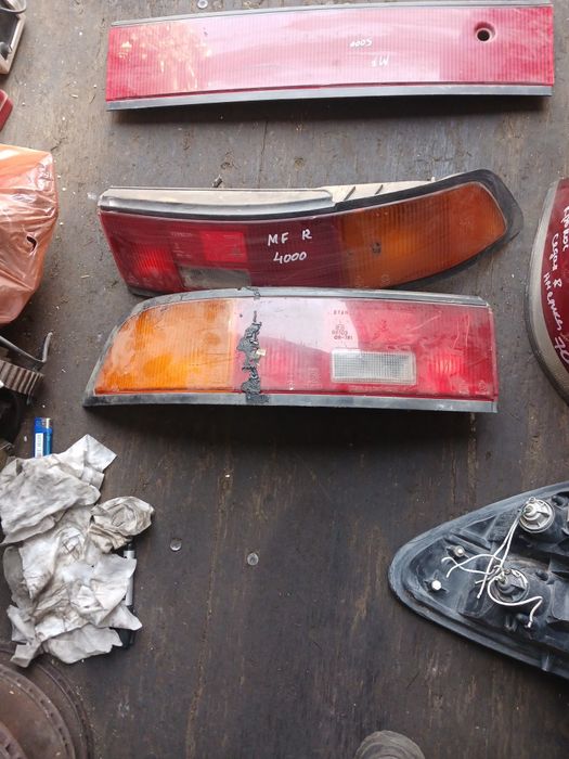 Фонарь Мазда 323F левый