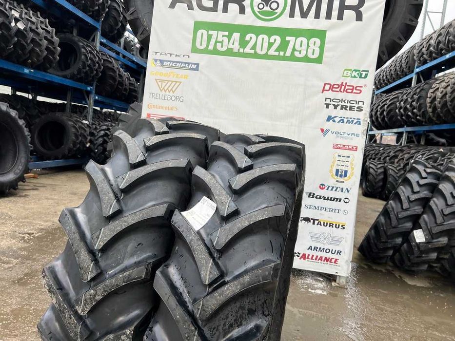Cauciucuri noi 14.9-26 cu 10 pliuri marca OZKA pentru combina