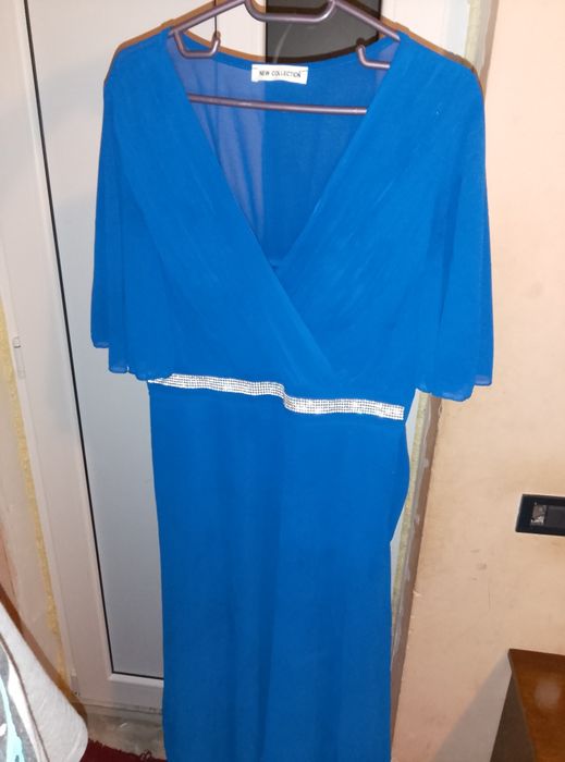 Rochie albastra scurta cu mânici scurte .A fost odată purtata  .