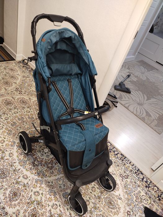 Бала сүйрететін арба. Коляска детский