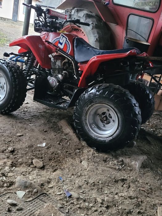 Vand atv de 250cc sau schimb