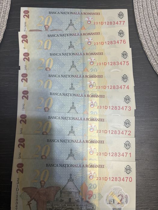 Vand 8 bancnote de 20 de ron serii consecutive