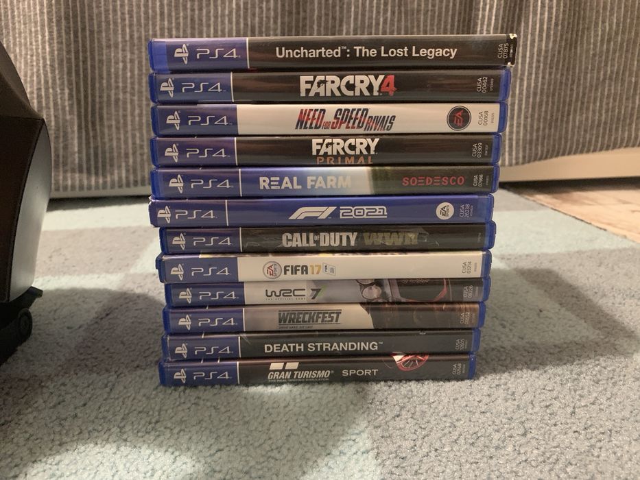 Volan PlayStation, pedale, și 12 jocuri