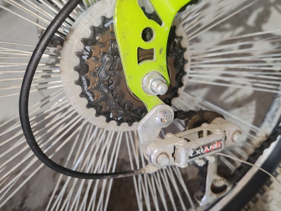 Велосипед горный 2 амортизатора по центру1 и на руле компания OLYMPIA