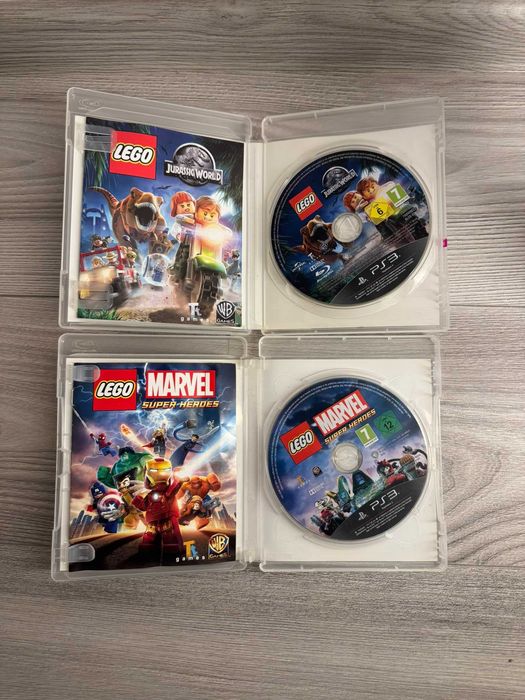 Lot 2 jocuri LEGO PS3 – Jurassic World + Marvel Super Heroes, cu manuale