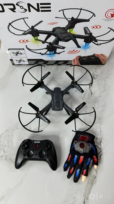 Dron. Дрон квадрокоптер с сенсорной перчаткой.