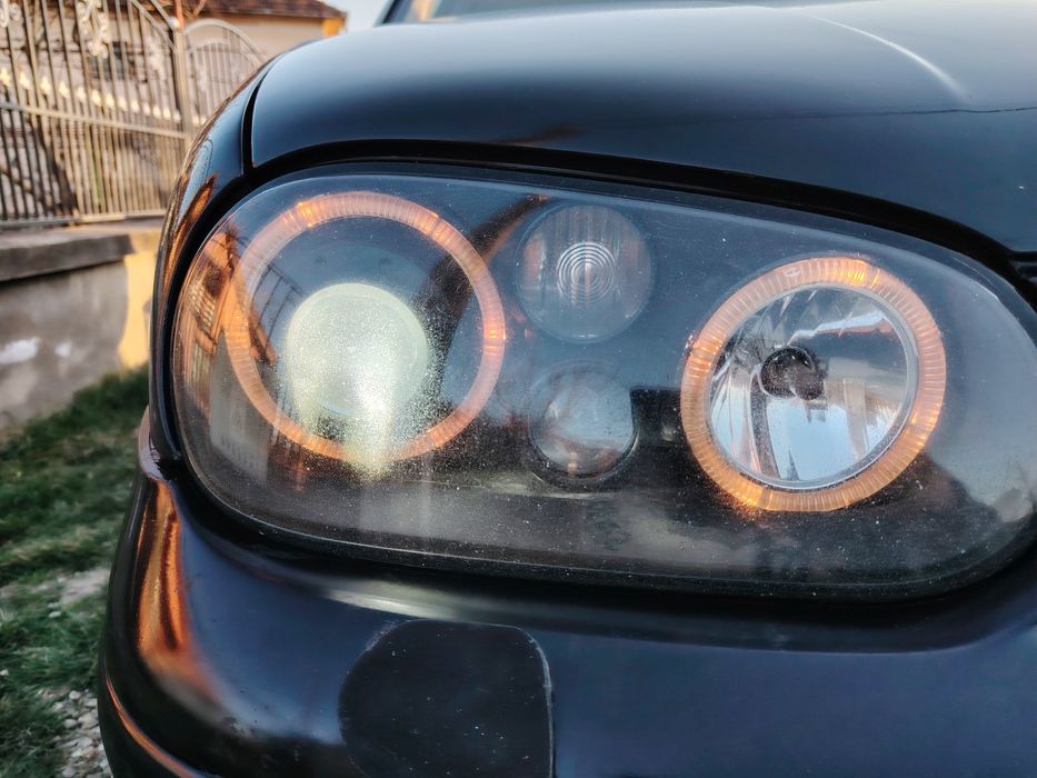 Set faruri Vw Golf 4  cu angel eyes si lupă