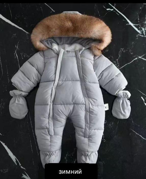 Продам зимний комбинезон.рост  66см