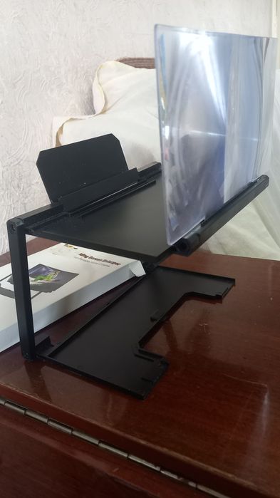 Продается  подставка для телефона с лупой