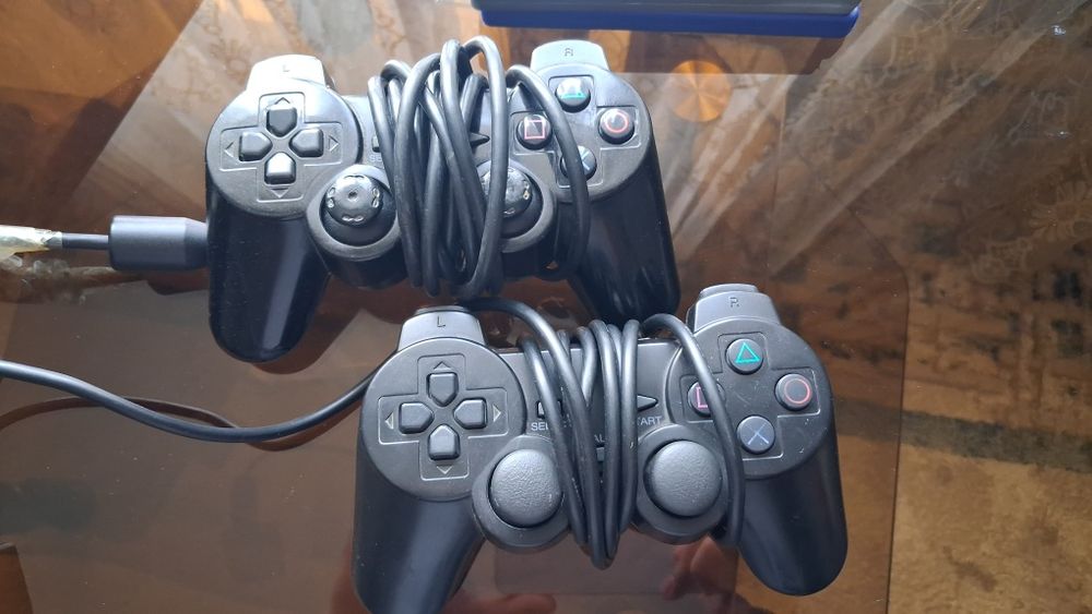 Playstation 2/идеальный 2джостик и 3 игры продам или обменять на тел
