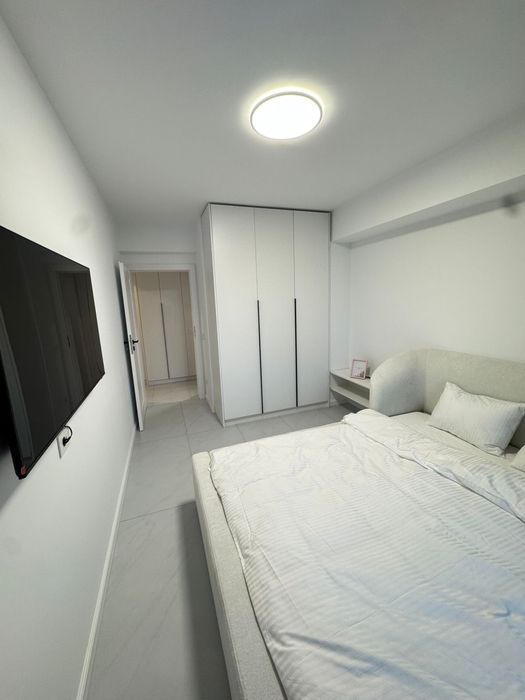 Chirie apartament 2 camere + living, cu parcare, in bloc nou nufarul
