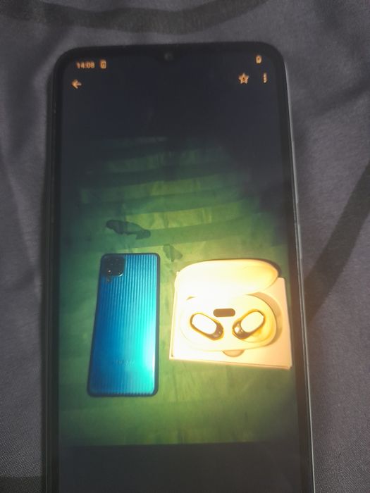 Самсунг м 12 и редми  1