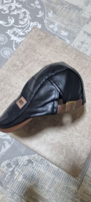 Кепка сотилади. Кожа. 56-58 размер.