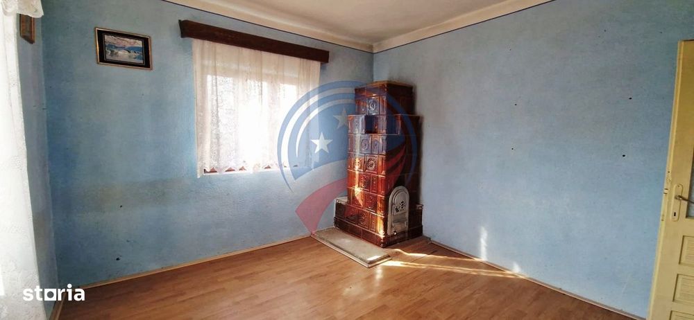Casa Bradesti  teren  intravilan 7952 mp  deschidere 33 m la DE 70