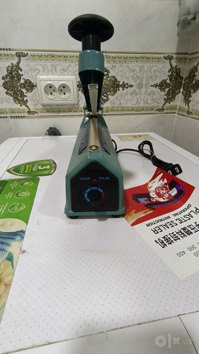 Paket yopishtirish apparati