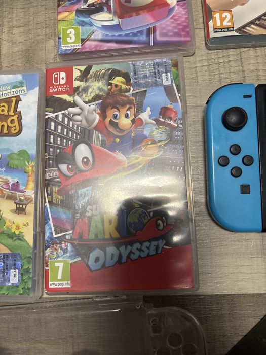 Vand nintendo switch+ accesori si 10 jocuri