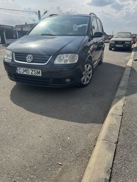 Vând touran DSG sau schimb