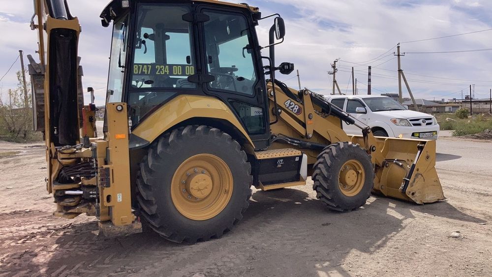 Услуги экскаватора-погрузчика