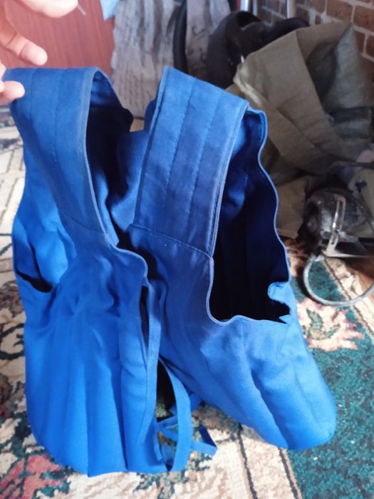 Жилет утежалитеь