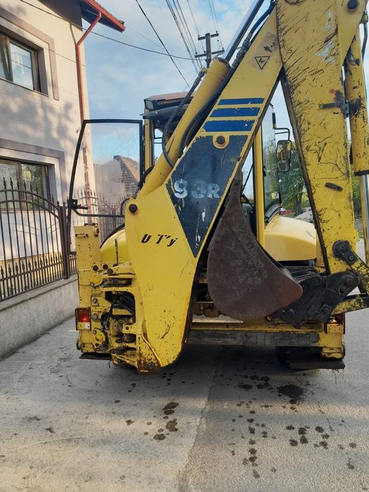 Buldoexcavator komatsu 93 r