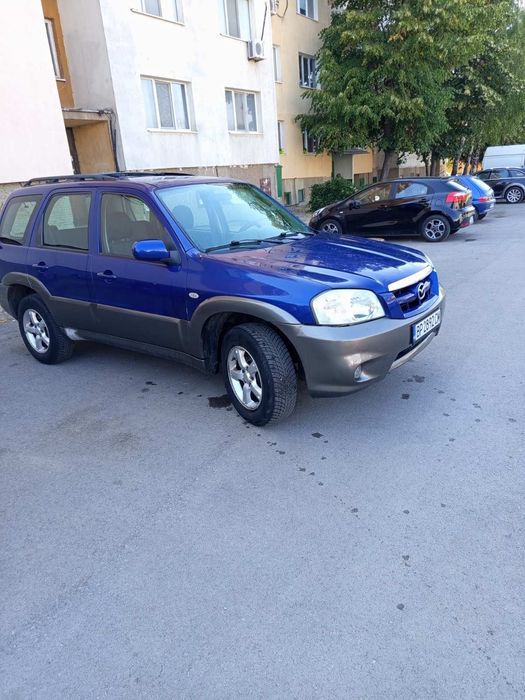 Кола Mazda Tribute