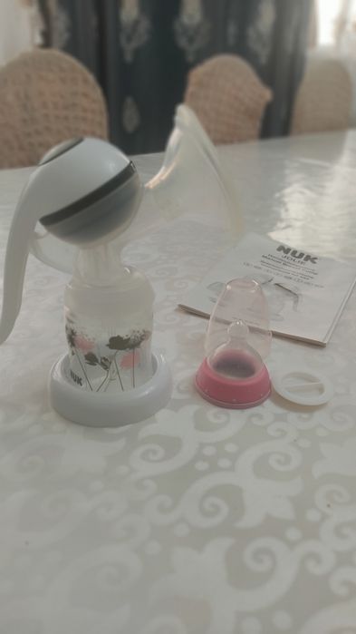 Молокоотсос фирма NUK