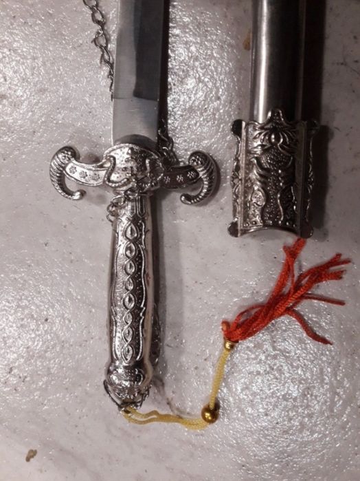 Срасив синжал,нож,кортик кама