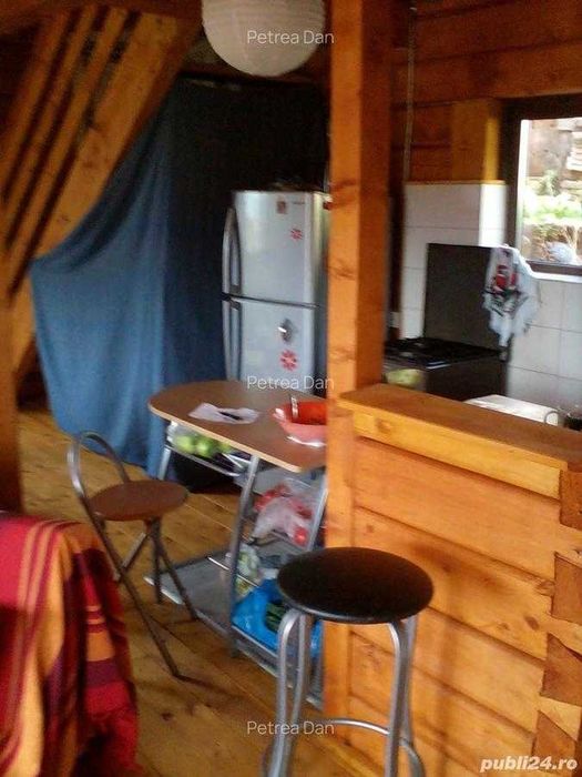 Casa din lemn masiv cu teren in Muntele Rece
