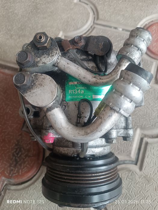 Компрессор кондиционера Мазда 323