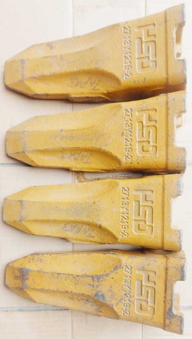 Зубья ковша погрузчика