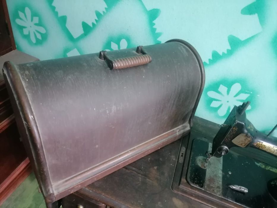 Masina de custut singer