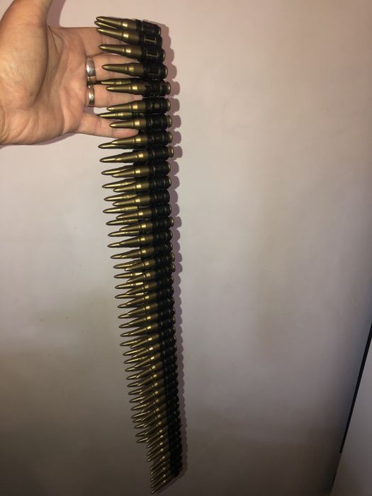 Banda de mitraliera cu 82 cartuse din plastic