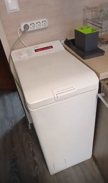 Пералня AEG,горно отваряне