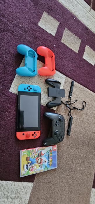 Nintendo switch + joc mario rabidds+ pro controller.