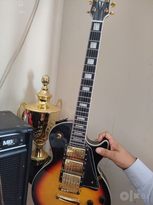 Gibson firmadan elektr gitara va marshalldan gitara uchun kalonka