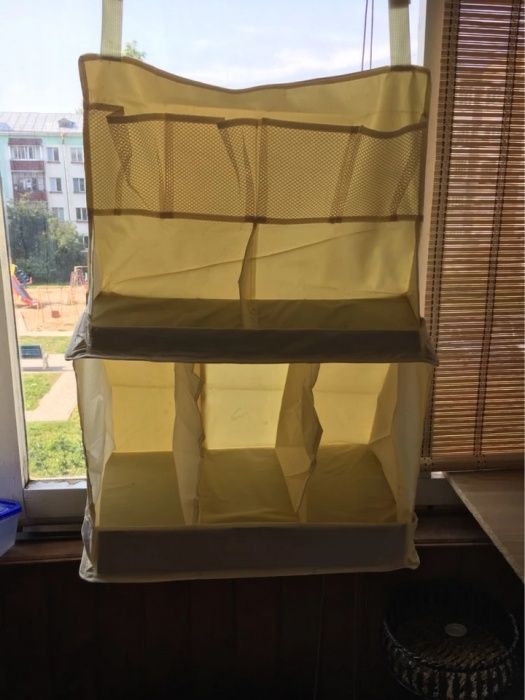 Raft din pânză ce poate fi prins de pătuțul bebelușului