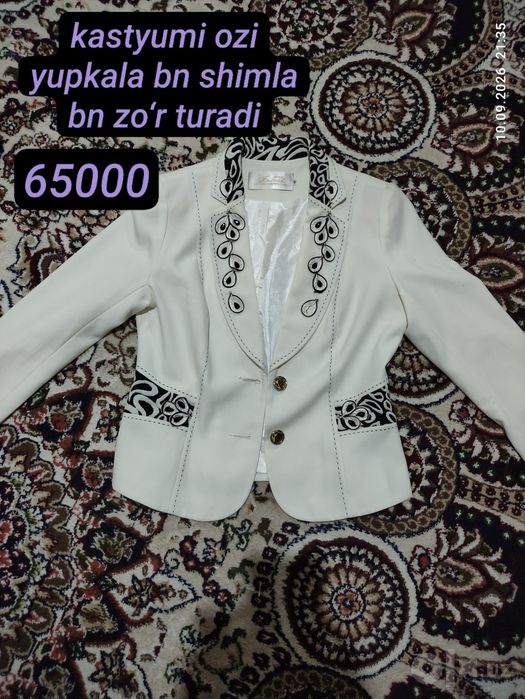 Oq kastyumcha rassa chiroyli turadi