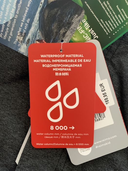 Продам новый комбинезон reima