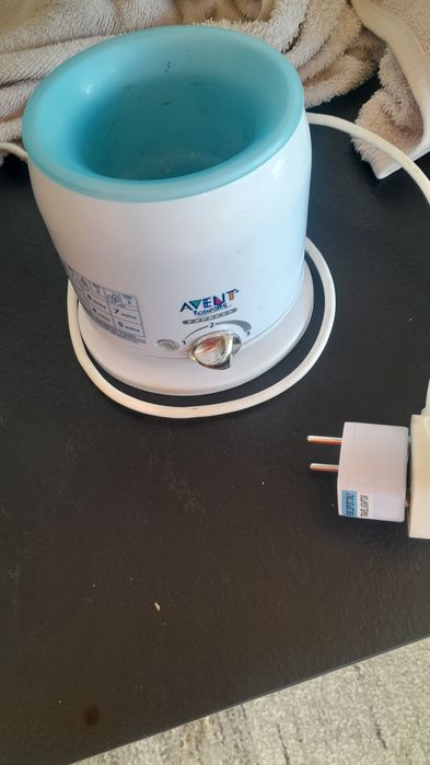 Уред за топлене на бебешко мляко