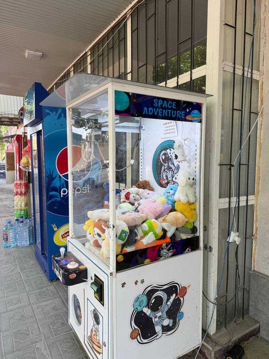 Хватайка. Кран апарат. Юмшоқ ўйинчоқлар сотиш қурилмаси