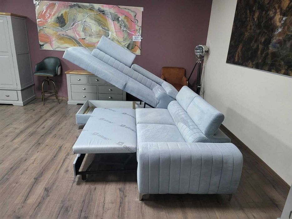 ПРОМОЦИЯ! Светло син ъглов диван от плат с функция сън и ракла