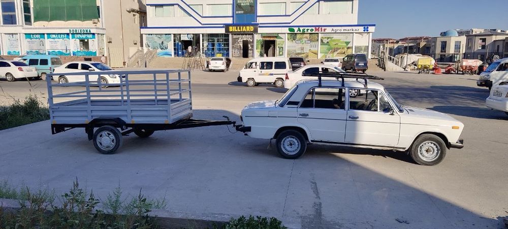 Автомабил сотилади зудлик билан прицепи бор охволи янги