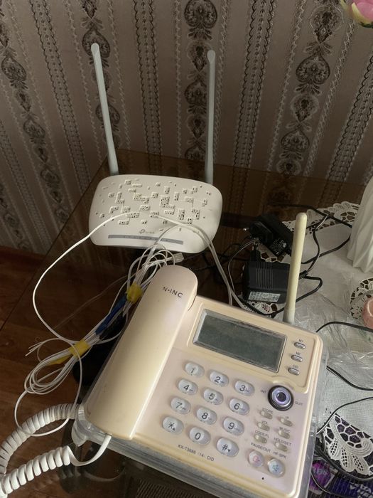 Новый модем роутер и многофункциональный стационарный телефон б/у в по