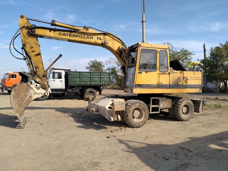 услуги колёсного эксковатора