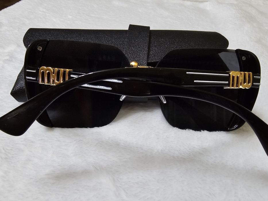 Солнцезащитные очки  Miu Miu (Миу Миу)