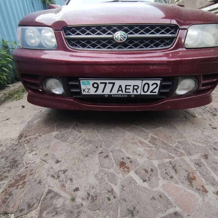 Передний бампер nissan r'nessa